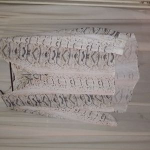 Milano cream and black snake skin design long sleeve V neck blouse